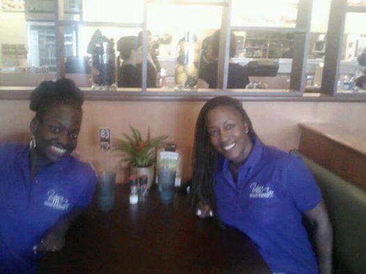 Two women representing an event team